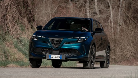 Alfa Romeo Junior Ibrida (2025) review: front three quarter cornering, uphill, blue paint