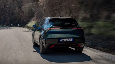 Alfa Romeo Junior Ibrida (2025) review: rear three quarter tracking, mid corner, blue paint