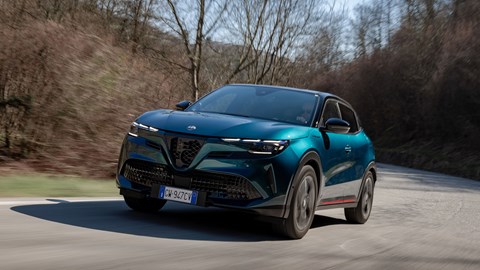 Alfa Romeo Junior Ibrida (2025) review: front three quarter tracking, mid corner, offset angle, blue paint