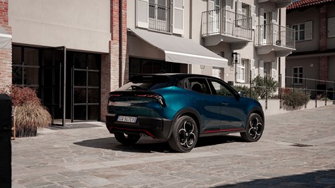 Alfa Romeo Junior Ibrida (2025) review: rear three quarter static, blue paint