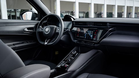 Alfa Romeo Junior Ibrida (2025) review: dashboard and steering wheel, black upholstery