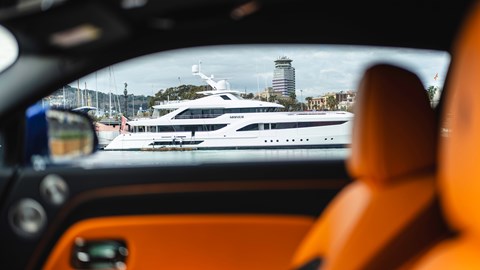 Rolls-Royce Spectre Black Badge - door and yacht