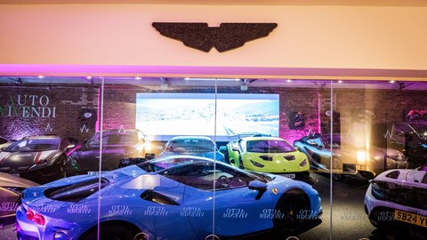 Cars lined up under the Auto Vivendi logo