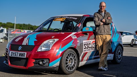 Image of Graham King with his Suzuki Swift Sport race car in the paddock at Silverstone circuit