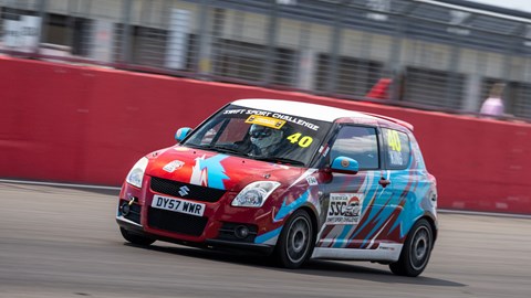 Image of Graham King's Suzuki Swift Sport race car turning into Copse corner at Silverstone circuit