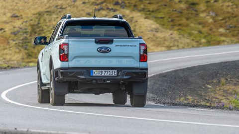 Ford Ranger PHEV review - Stormtrak, rear, grey, driving round corner