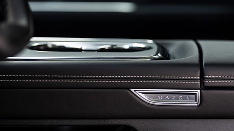 Mazda 6e (2026) review: centre console, black faux leather upholstery