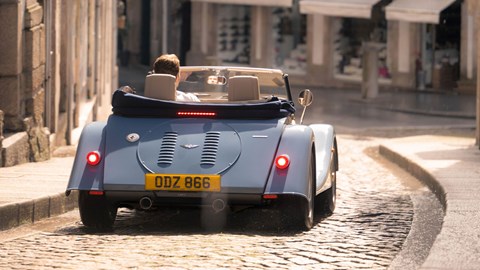 Morgan Plus Four review - rear, blue, driving in town