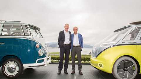 An original VW Microbus (left) meets the Volkswagen ID Buzz, as the bosses press the launch button