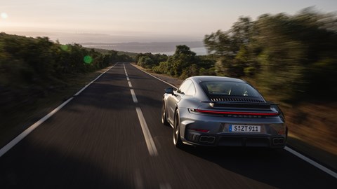 Porsche 911 Turbo S Coupe rear three-quarter driving