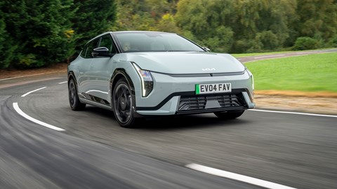 Kia EV4 Fastback (2025) review: front three quarter driving, green paint, low angle