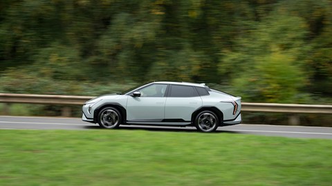 Kia EV4 Fastback (2025) review: side view driving, green paint