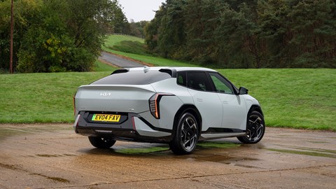 Kia EV4 Fastback (2025) review: rear three quarter static, green paint