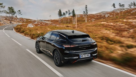 DS No.4 (2025) review: rear three quarter driving, black paint, grassland