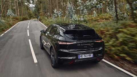 DS No.4 (2025) review: rear three quarter driving, through a forest, black paint
