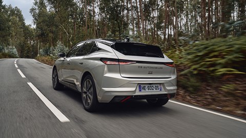 DS No.4 E-Tense (2025) review: rear three quarter driving, silver paint, forest in background