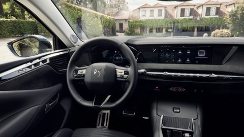 DS No.4 E-Tense (2025) review: steering wheel and digital gauge cluster, black upholstery
