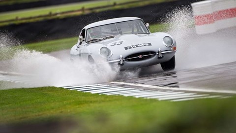 Jaguar E-type splashes through puddle at 2017 Goodwood Revival