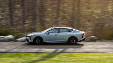 Kia K4 saloon side-on driving