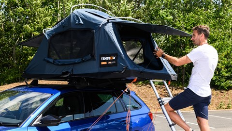 Oli climbing into the TentBox