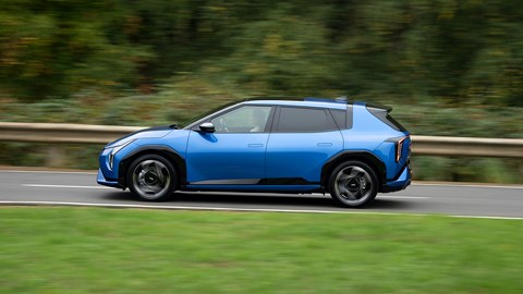 Kia EV4 (2025) review: side view driving, blue paint