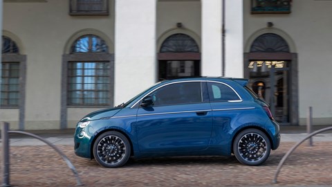 Fiat 500 Hybrid Torino edition 2025 side view driving in the streets of Turin