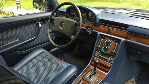 enormous four-spoke steering wheel with a padded central boss