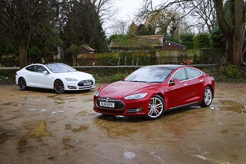 Our Tesla Model S 85D (white car) and the 100,000-mile Tesla owned by Chargemaster (red car)