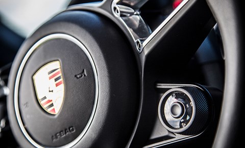 Steering-wheel-mounted overboost button makes leap from 918. Not quite Ferrari’s manettino, but…