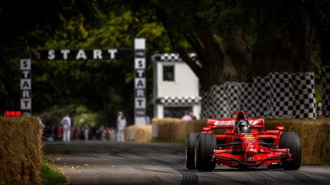 Red F1 Car off the start line at Goodwood