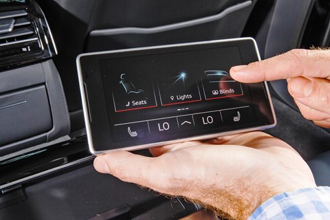 Rechargeable tablet sits in Audi A8 L rear armrest, controls many minor functions