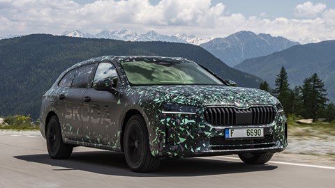 Skoda Superb prototype: front three quarter driving, camouflage wrap, country lane