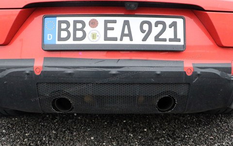 Hidden exhaust pipes denote the Porsche Cayenne Coupe GT model