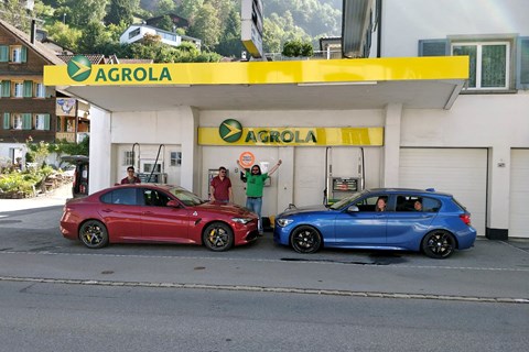 Alfa Romeo Giulia, BMW M135i filling up in Lucerne
