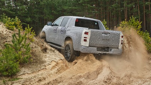 New VW Amarok, rear view, disguised, driving off-road fast