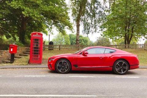 Pillar-box red Bentley meet Royal Mail box and timeless British telephone kiosk