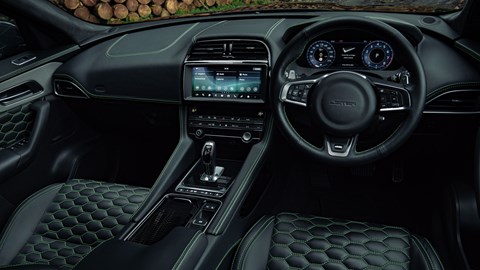 Lister Stealth - interior showing dashboard, black leather with green stitching