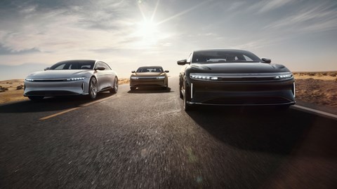 Lucid Air electric car, in triplicate, driving towards camera