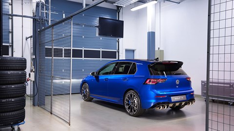 Facelifted Volkswagen Golf R: rear three quarter static, studio, in a cage, blue paint