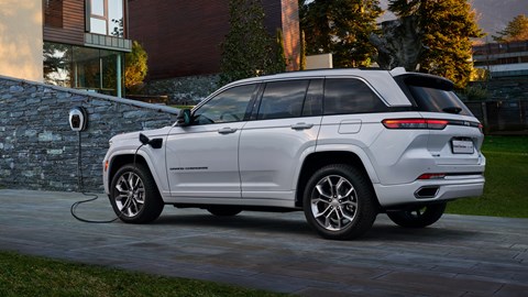 2022 Jeep Grand Cherokee, rear view, 4xe plugged in to charge