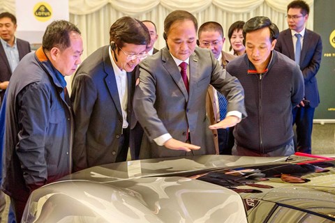 Geely execs pore over Evija at UK trade event