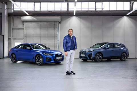 BMW CEO Oliver Zipse with the electric IX SUV and i4 saloon