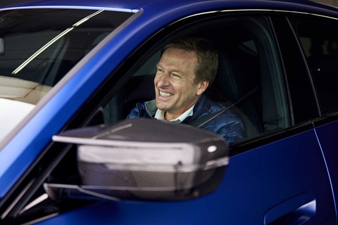 BMW CEO Oliver Zipse in the new i4 electric saloon