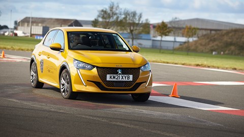 Driving a Peugeot e-208 around the Bedford Autodrome