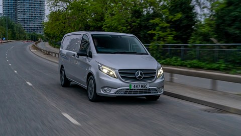 Mercedes-Benz eVito driving with city in the background