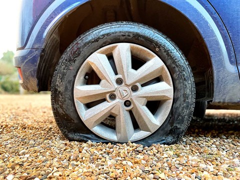 Uh-oh: puncture on our Dacia Sandero