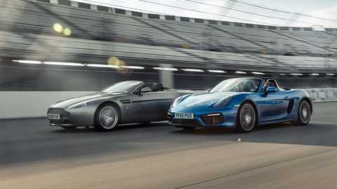 A couple of European roadsters in their, er, natural environment; a banked speedway…