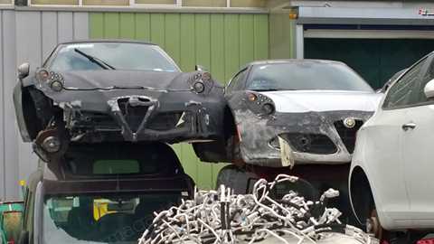 Alfa Romeo 4C test hacks spotted in a crusher's yard in Italy