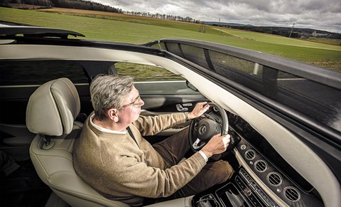 Our Georg with hands on the wheel. Not always necessary in this car